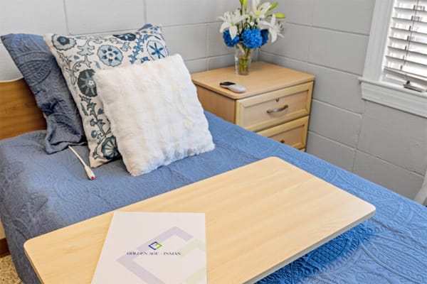 Cozy resident room with blue bedding and decor