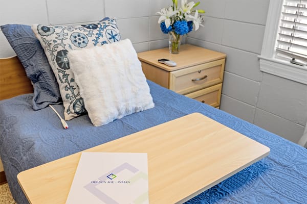 Cozy resident room with blue bedding and decor