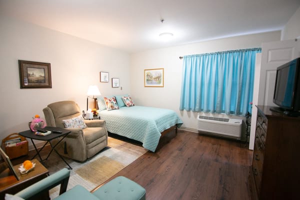 Cozy private room with teal accents and a warm atmosphere