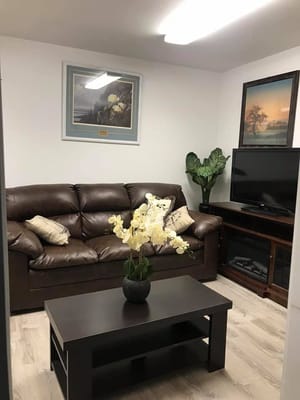 Cozy living area with a sofa and decorative plants