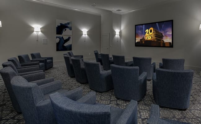 Cozy movie theater room with comfortable seating