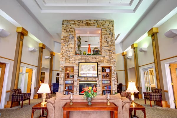 Common area with stone fireplace and comfortable seating