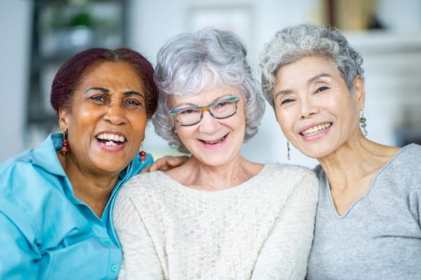 Three residents enjoying a joyful moment together