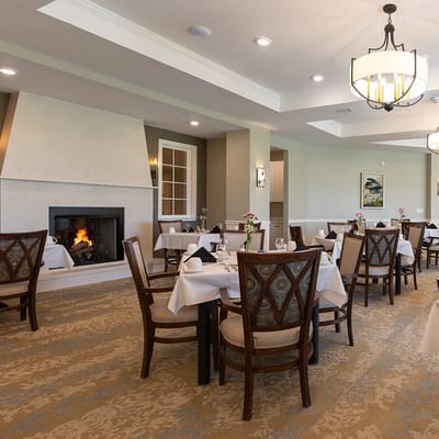 Dining room with tables set for residents