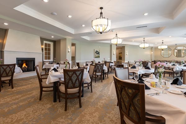 Elegant dining room with tables set for meals