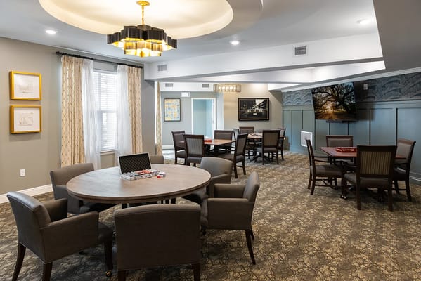 Bright common area with tables and chairs
