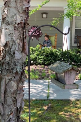 Resident relaxing on the porch of the facility