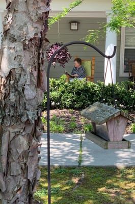 Resident relaxing on the porch of the facility