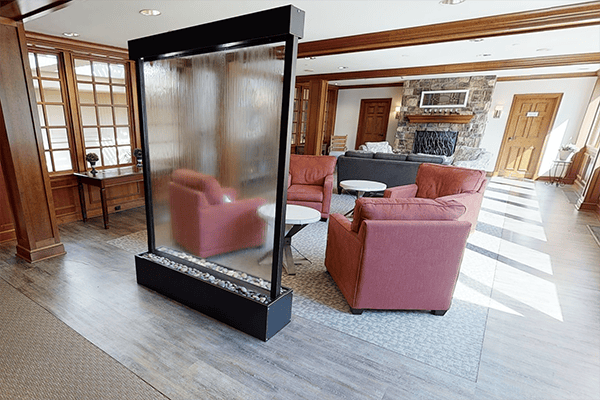 Cozy lounge area with comfortable seating and a water feature