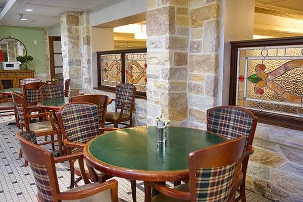 Bright dining room with wooden tables and chairs
