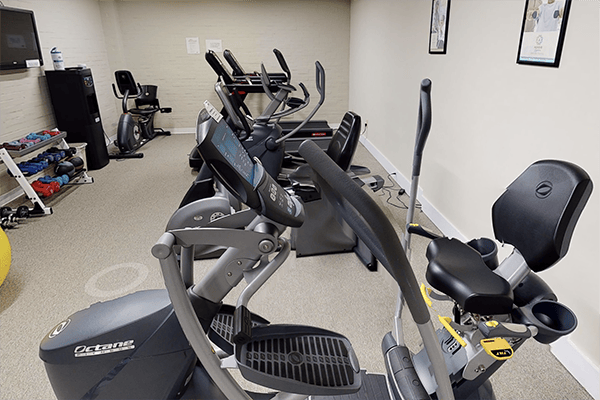 Fitness equipment in an exercise room for residents
