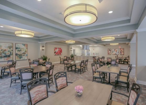 Bright dining room with tables and chairs