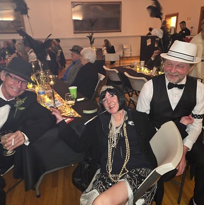 Residents enjoying a themed party with flapper attire