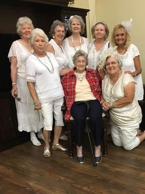 Residents celebrating with matching outfits and smiles