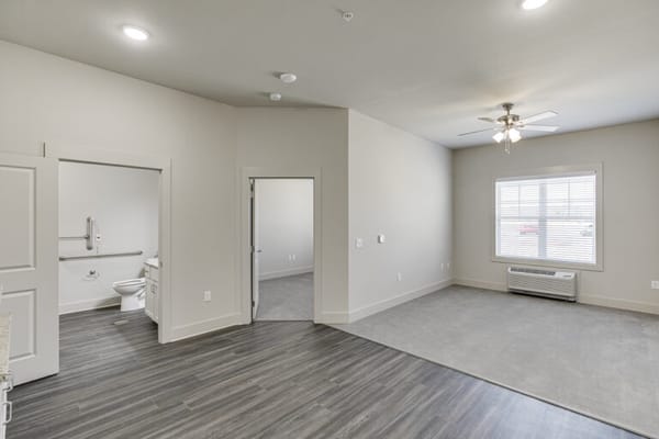 Interior view of a resident room with bathroom