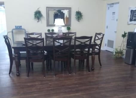 Interior view of a dining room with a large table and chairs