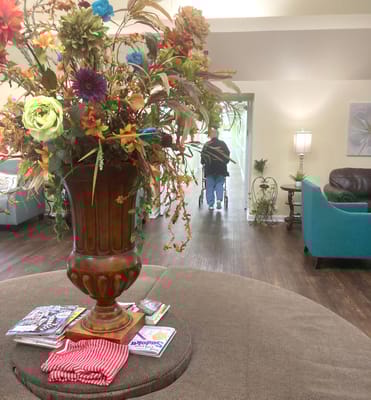 Interior view of a common area with floral arrangement