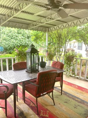 Outdoor seating area with a table and chairs