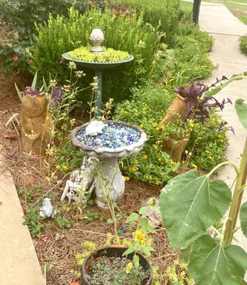 A decorative outdoor garden space with a fountain