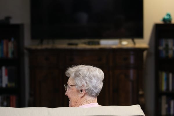 Senior woman sitting in a living room