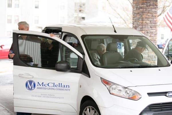Residents entering a facility vehicle outside