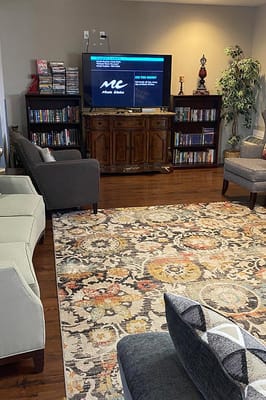 Common area with seating and entertainment setup