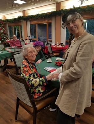 Residents enjoying a holiday gathering in a common area
