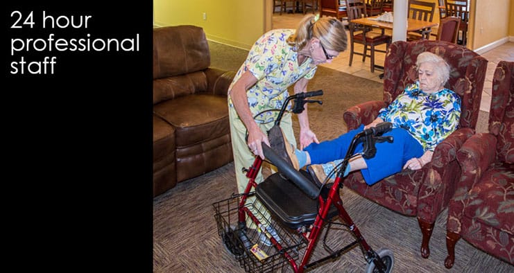 Staff assisting a resident in a common area