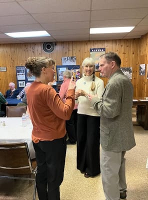 Residents and staff chatting in a common area