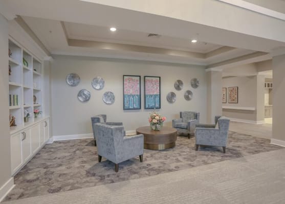 Common area with seating and decorative artwork