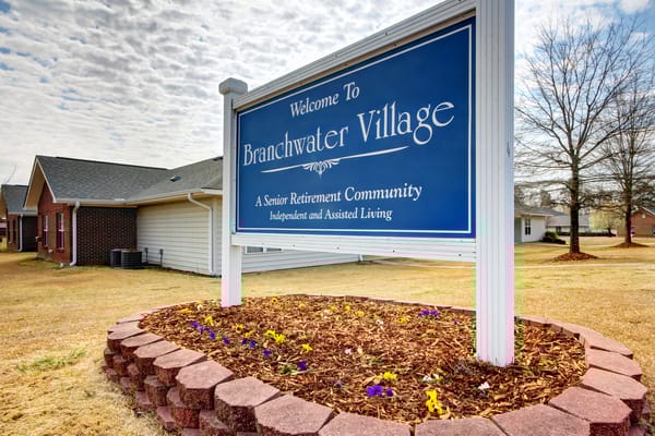 Sign for Branchwater Village with landscaping