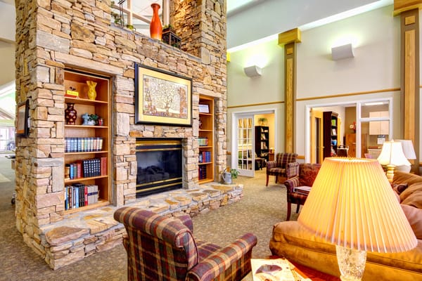 Cozy common area with stone fireplace and comfortable seating