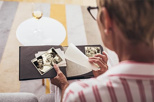 Senior resident looking through a photo album