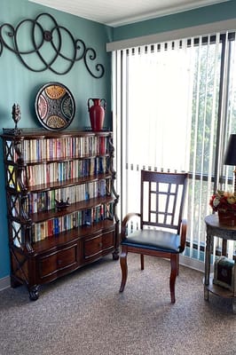 Comfortable reading nook with bookshelves and chair