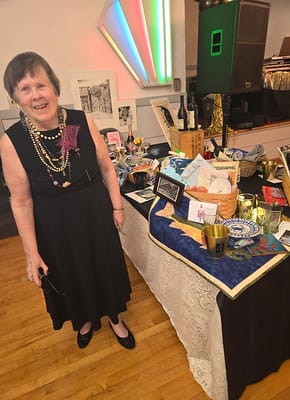 Resident participating in a social event with a decorated table