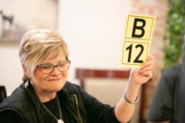 A staff member engaging with residents during an activity