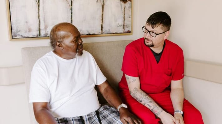 A resident and staff member engaging in conversation
