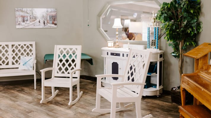 A cozy common area with rocking chairs and decorations