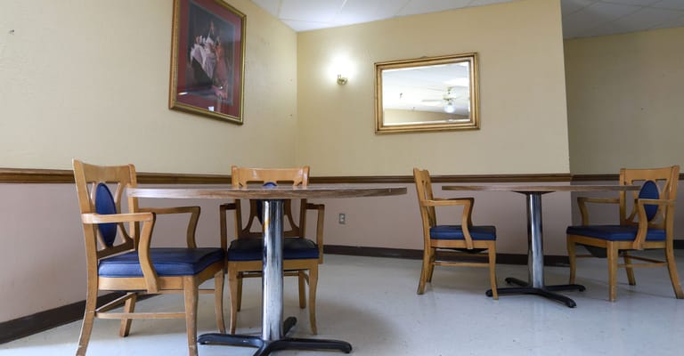 Dining area with wooden tables and chairs