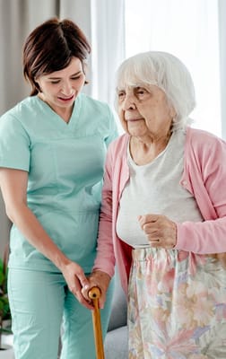 Nurse assisting an elderly resident in a care facility