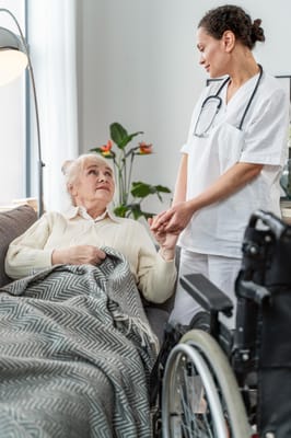 A nurse attending to a resident in a cozy living room