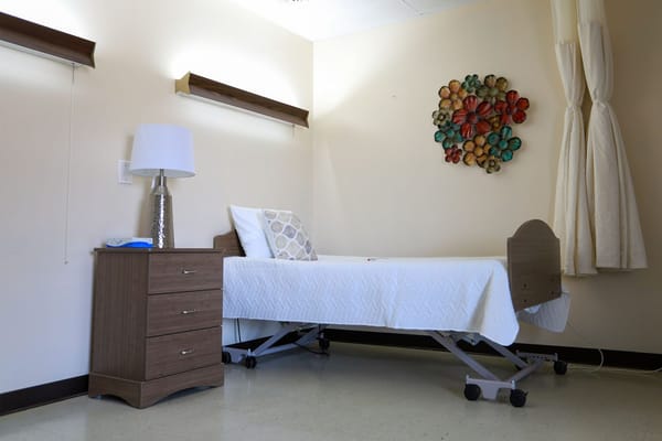 A private resident room with a bed and decorations