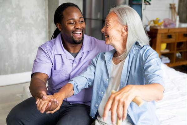 Staff member interacting joyfully with a resident