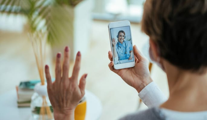 A resident video chatting with a staff member