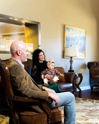 Family visiting in a comfortable lounge area