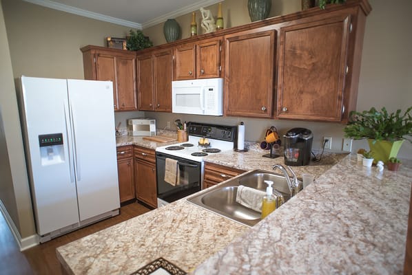 Spacious kitchen with modern appliances and cabinetry