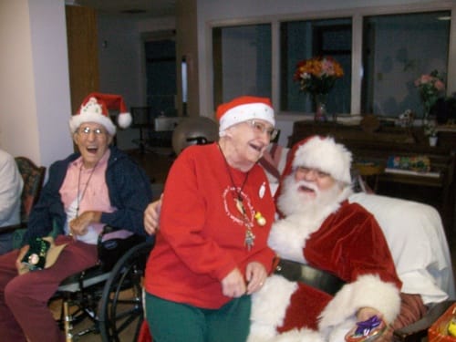 Residents celebrating Christmas with Santa Claus