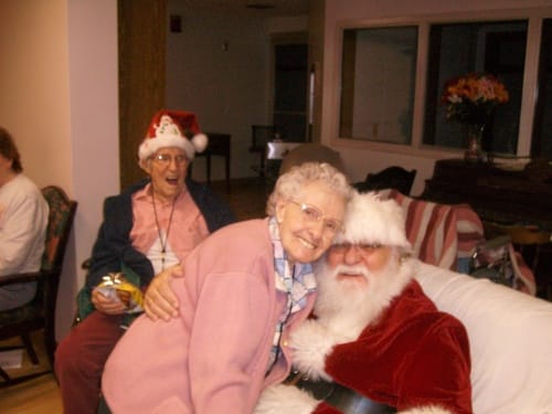 Residents enjoying a visit from Santa Claus during a festive event