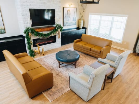 Cozy common area with seating and fireplace