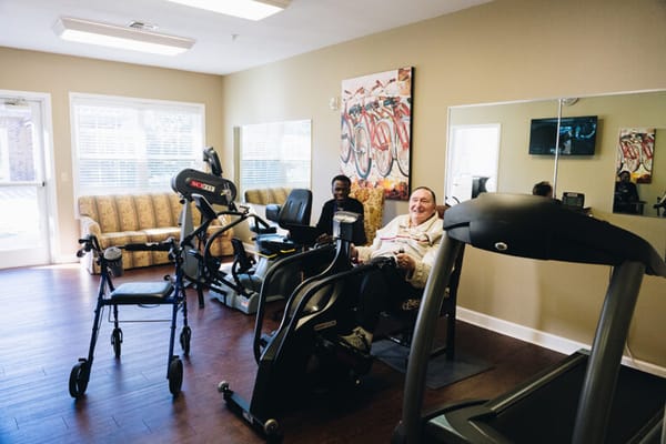 Residents exercising in the fitness room